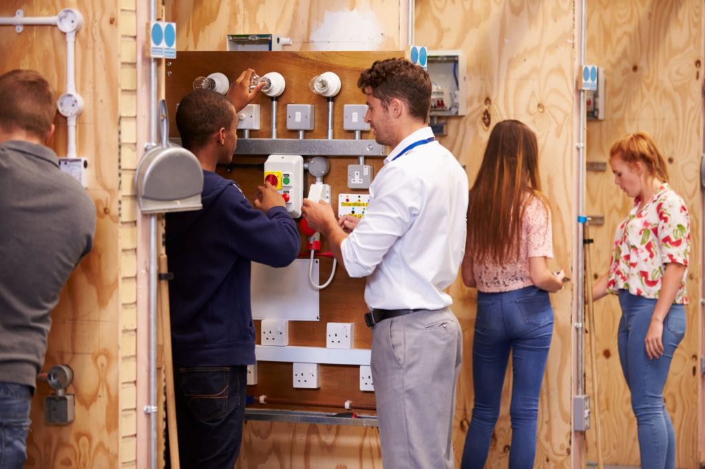 A student attending an electrical training course