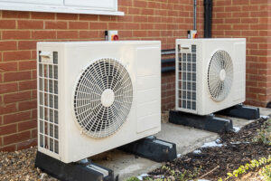 Two,Air,Source,Heat,Pumps,Installed,On,The,Exterior,Of Proprty F-Gas Regulations